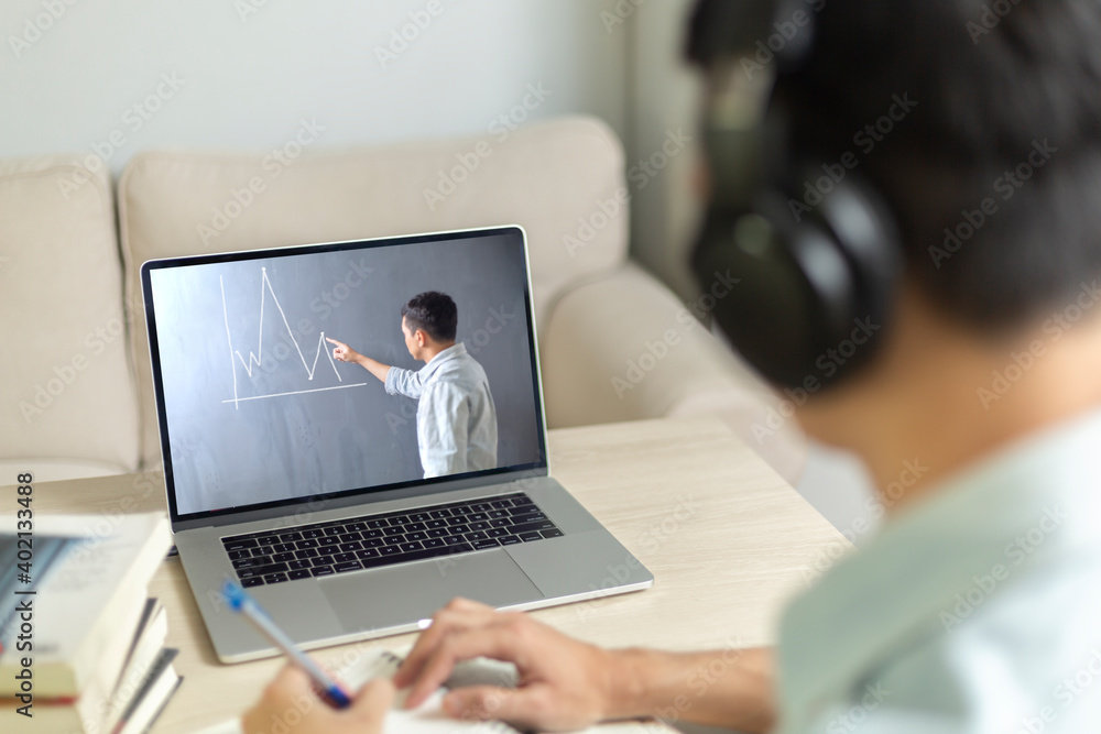 A man online learning classroom and social distancing in new normal concept A man online learning classroom and social distancing in new normal concept