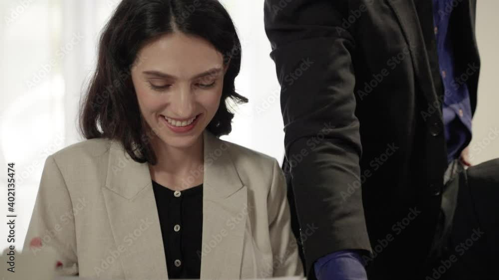 The smile of the young businesswoman during the meeting
The smile of the young businesswoman during the meeting