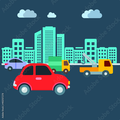 City life with tall multistory buildings with vehicles like car truck moving in main road in night time with clouds in sky