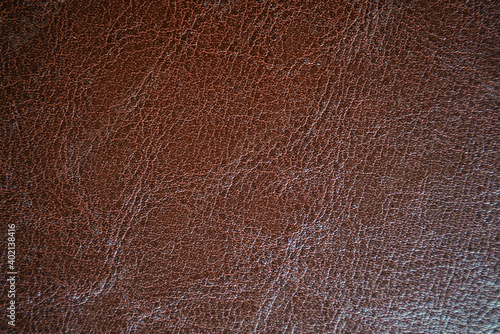 Close up of brown leather texture. Grunge skin fabric background.