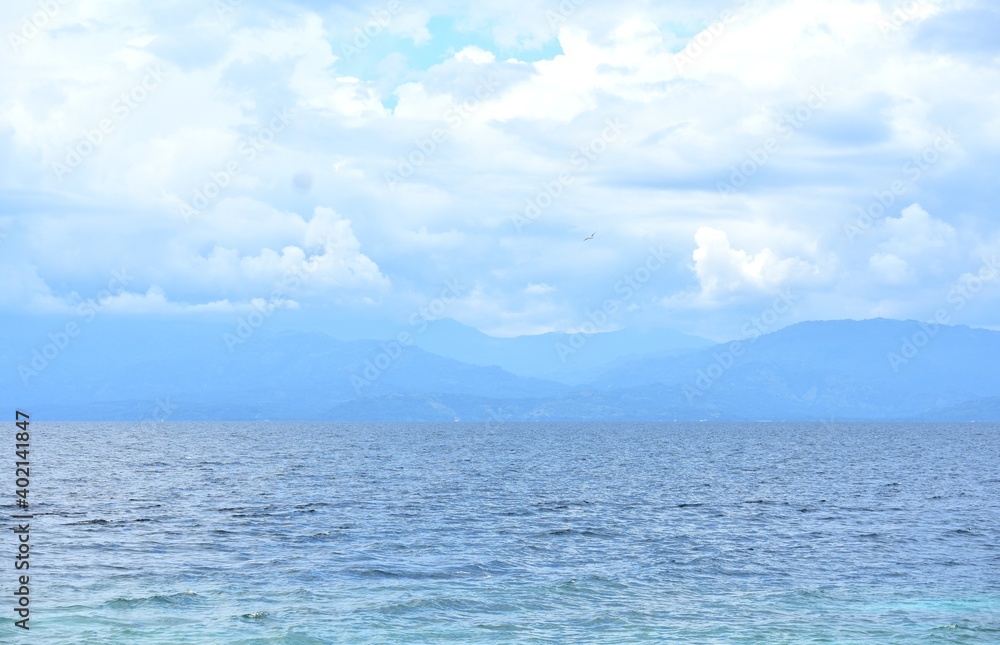 Blue Ocean Water Horizon And Cloudy Sky