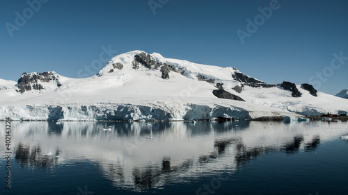 Snowy mountains in Paraiso Bay, Antartica.