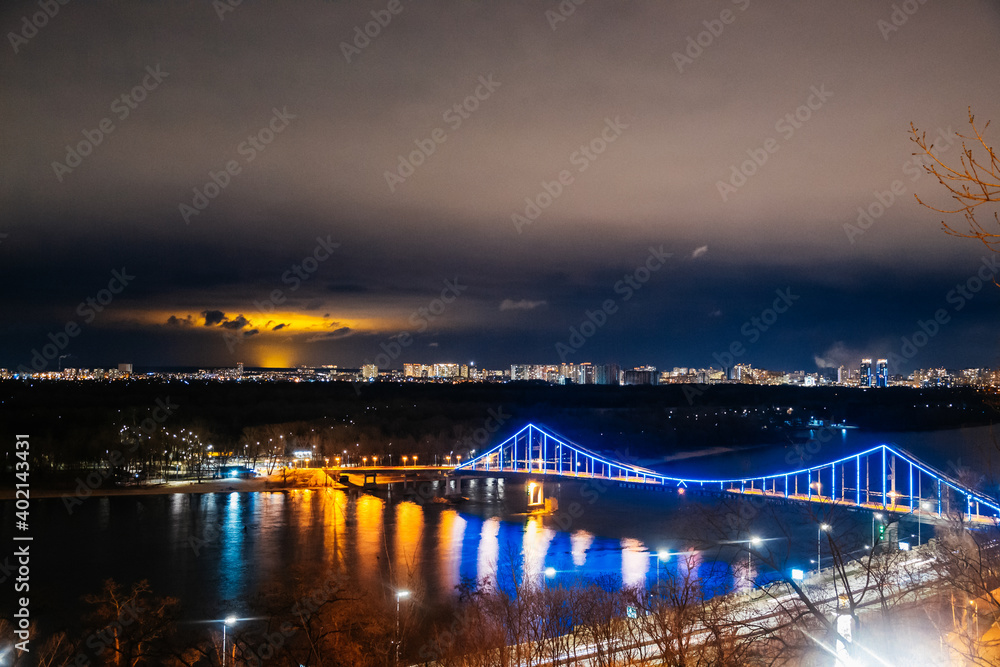 Cityscape view on the left side of Kyiv, Ukraine. The panoramic point in the touristic road. Night city with bright lights and magic atmosphere. Point view on Volodymyrska hill. 