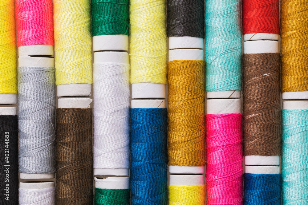Background from multi-colored spools of thread Background from multi-colored spools of thread