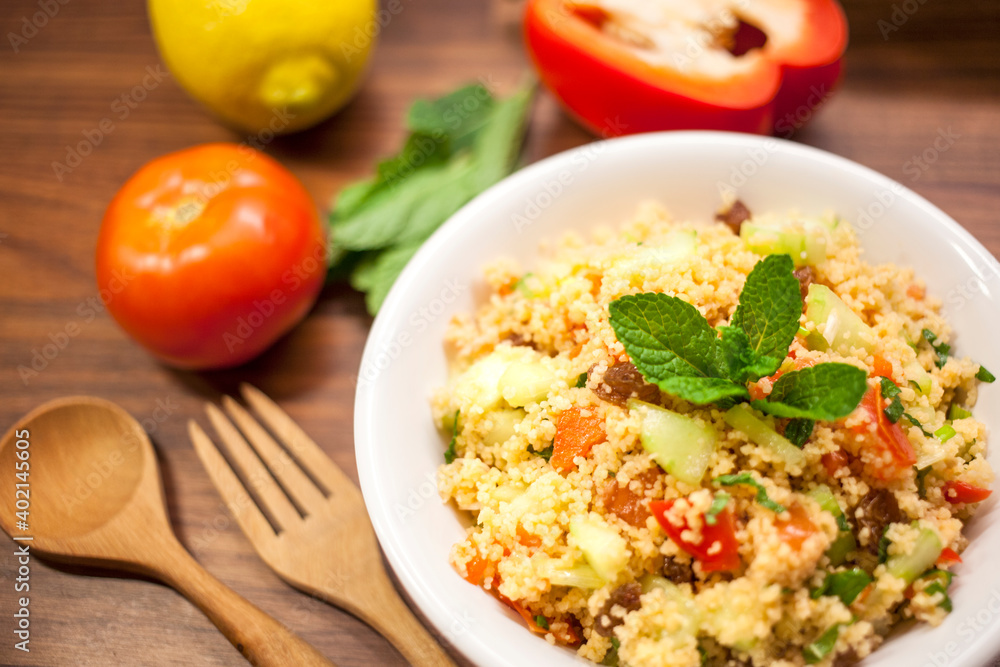 fresh tabbouleh salad on a wooden background fresh tabbouleh salad on a wooden background