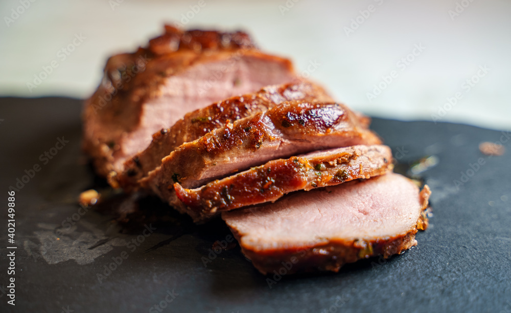 Sliced duck fillet on granite plate. Sliced duck fillet on granite plate.