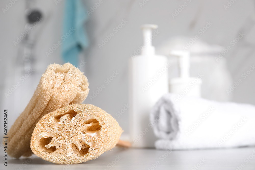 Natural loofah sponges on table in bathroom. Space for text Natural loofah sponges on table in bathroom. Space for text