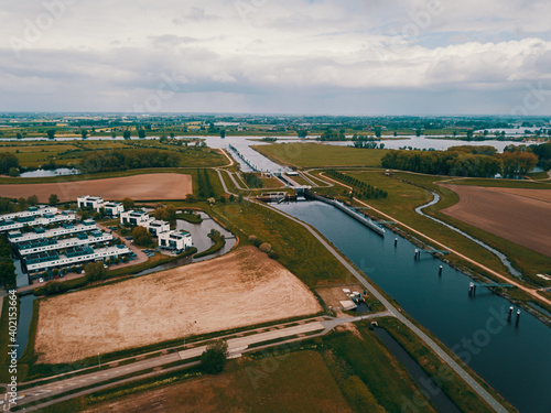 Photography Aerial drone shot of the dam and big canal in the Netherlands.
