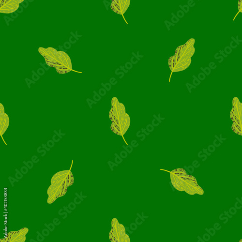 Minimalistic seamless doodle pattern with simple decorative oak leaf ornament. Green background.