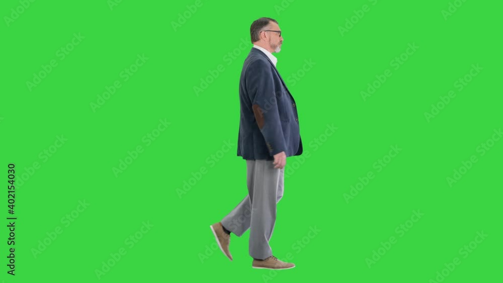 Senior business man walking forward on a Green Screen, Chroma Key. Senior business man walking forward on a Green Screen, Chroma Key.