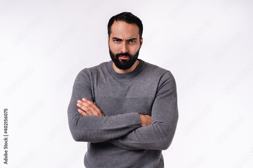 Fototapeta premium Angry handsome Arab man in casual attire isolated over white background