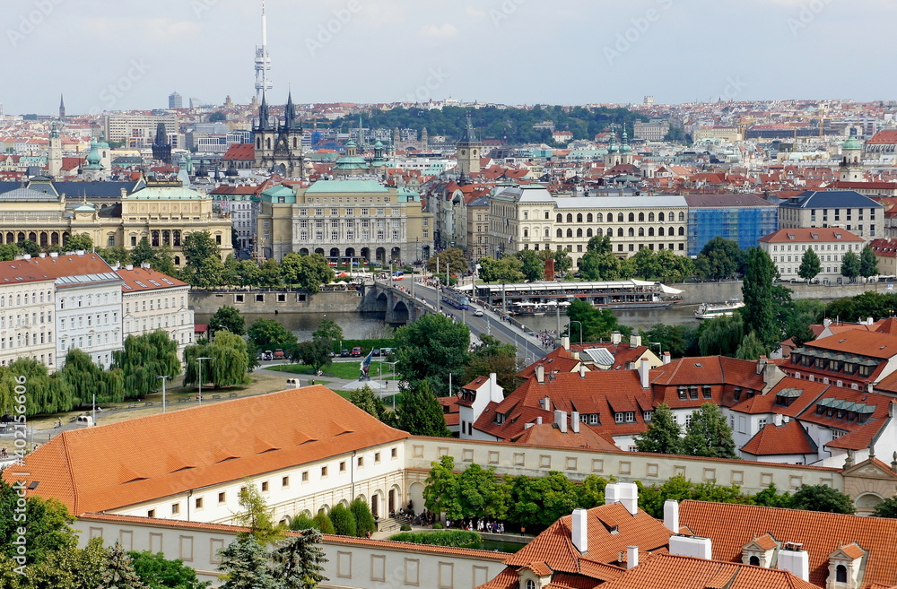 PRAGUE, CZECH REPUBLIC - JULY 27, 2019. Panoramic view of the city from Prague Castle. view of Manesuv Bridge and in the direction of the Old Town Square featuring Church of Our Lady before Tyn