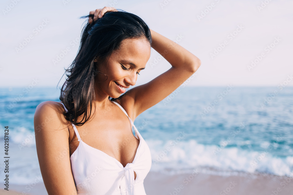 Cheerful girl with perfect cute smile enjoying leisure time for coastline promenade during solo vacations on Philippines, happy female tourist recreating during voyage international holidays
