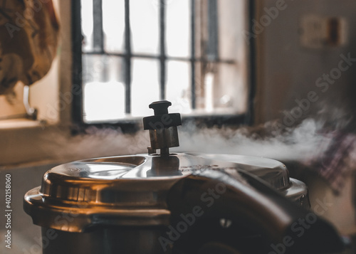 Pressure cooker whistling in kitchen