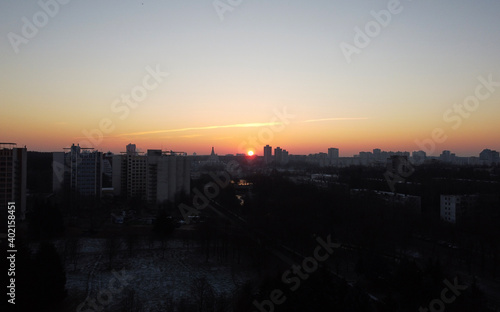 Top view of the sunrise in a european city in winter © Payllik