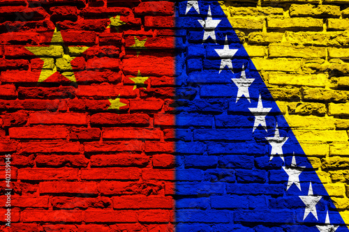 Flag of China and Bosnia on brick wall