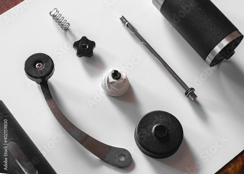 Neatly arranged parts of manual coffee grinder