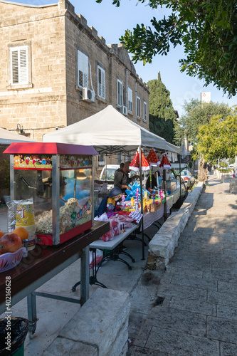 A street shop selling drinks, popcorn and toys for children on Sderot Ben Gurion Street in the city of Haifa in northern Israel