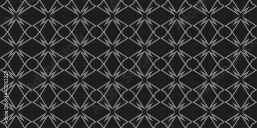 Gray geometric ornament on a black background. Monochrome pattern. Seamless wallpaper texture. Vector illustration for design. 