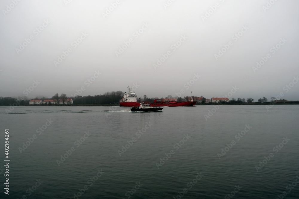 The ship goes to sea in the rain, the town of Baltiysk, Kaliningrad region, Russia