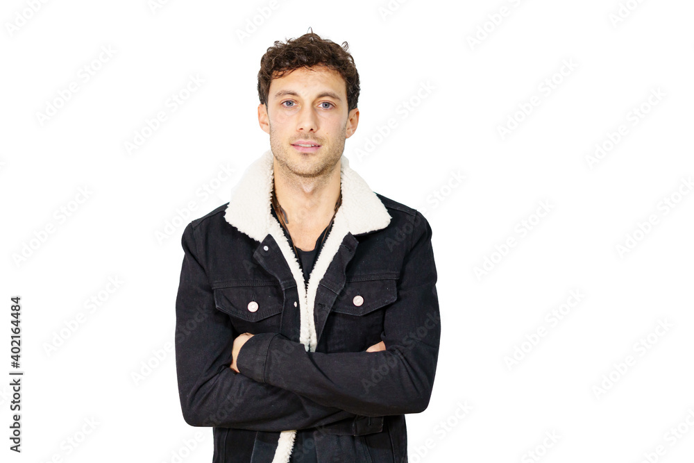 Young man with informal clothes crossing the arms while facing the camera isolated on white Young man with informal clothes crossing the arms while facing the camera isolated on white
