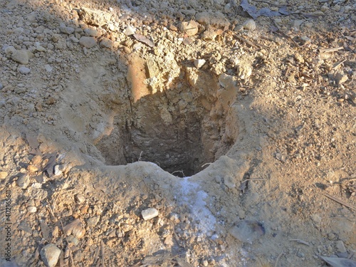 Man-made earth holes Caused by the use of mining tools Dig a hole