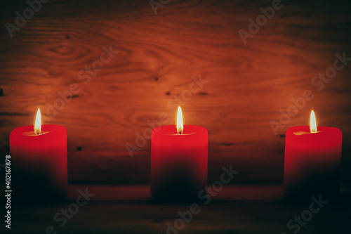 candles on the old wooden background with shading around the edges. holiday concept