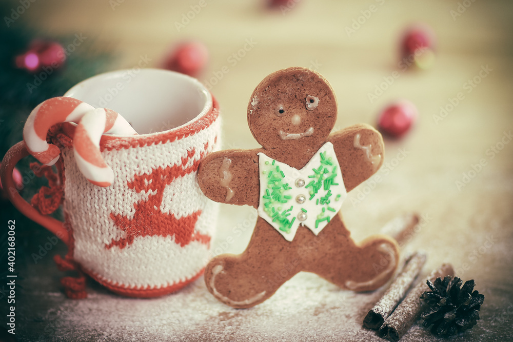 Christmas Cup ornament and candy on a wooden table Christmas Cup ornament and candy on a wooden table