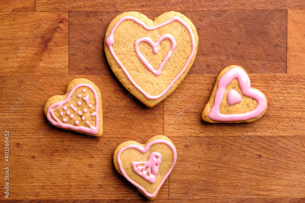 Heart shaped gingerbread cookies on the wooden background. Gift for St. Valentines Day. Heart shaped gingerbread cookies on the wooden background. Gift for St. Valentines Day.