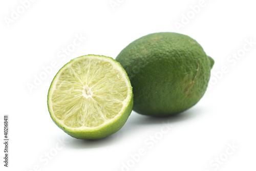 Closeup of fresh green lemon on white background