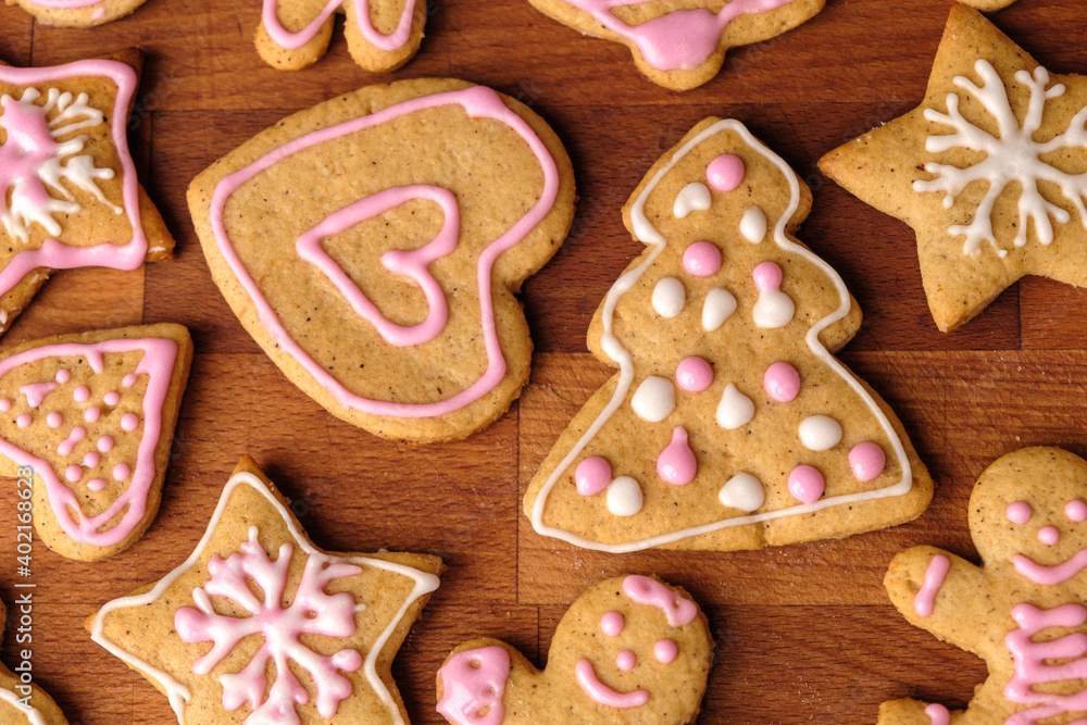 Icing gingerbread cookies on a wooden background Icing gingerbread cookies on a wooden background