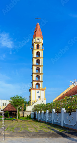 The bell tower of Cai Mon church. It is located in Cai Mon town, Cho Lach district, Ben Tre province. It was built 1702 during the French colonial period and is the oldest church in South Vietnam. photo