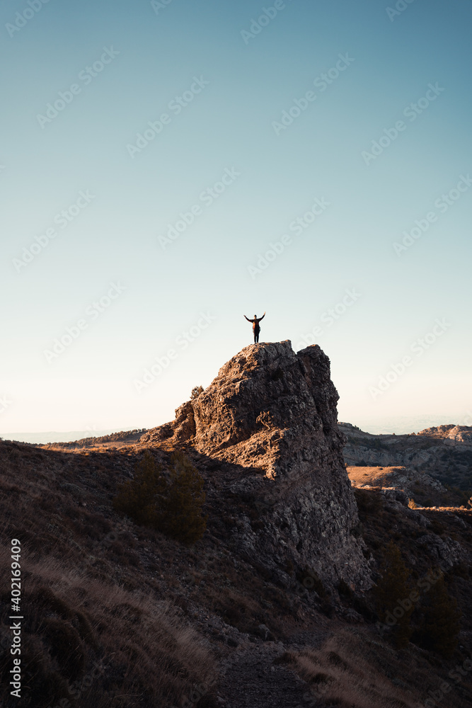 Man in the mountain at sunset. Guy practicing trekking Man in the mountain at sunset. Guy practicing trekking