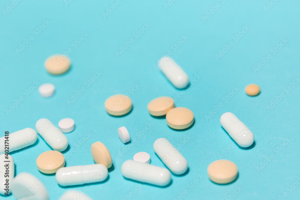 close up. various tablets on a blue background. close up. various tablets on a blue background.