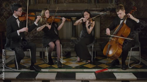 String Quartet Finishing A Piece During A Performance photo