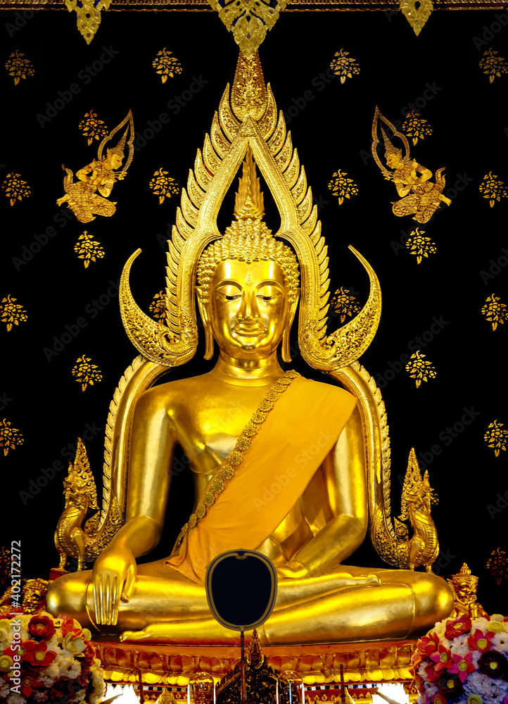 Fototapeta premium Closeup Shot of The Beautiful Phra Buddha Chinnarat (Sukhothai-style), One of The Most Important or Famous Buddha Statues in Thailand. Selective Focus at The Buddha Face and Blurred Background.