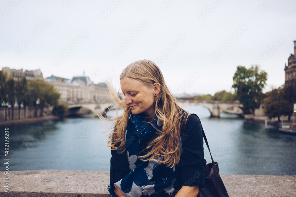 Female tourist on windy Paris day