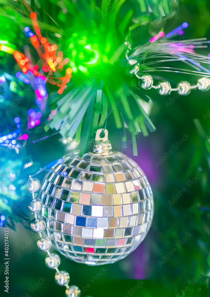 Obraz premium Shiny Christmas ball and decorations hanging on a Christmas tree