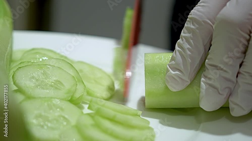 A peeled green cucumber sliced, close-up photo