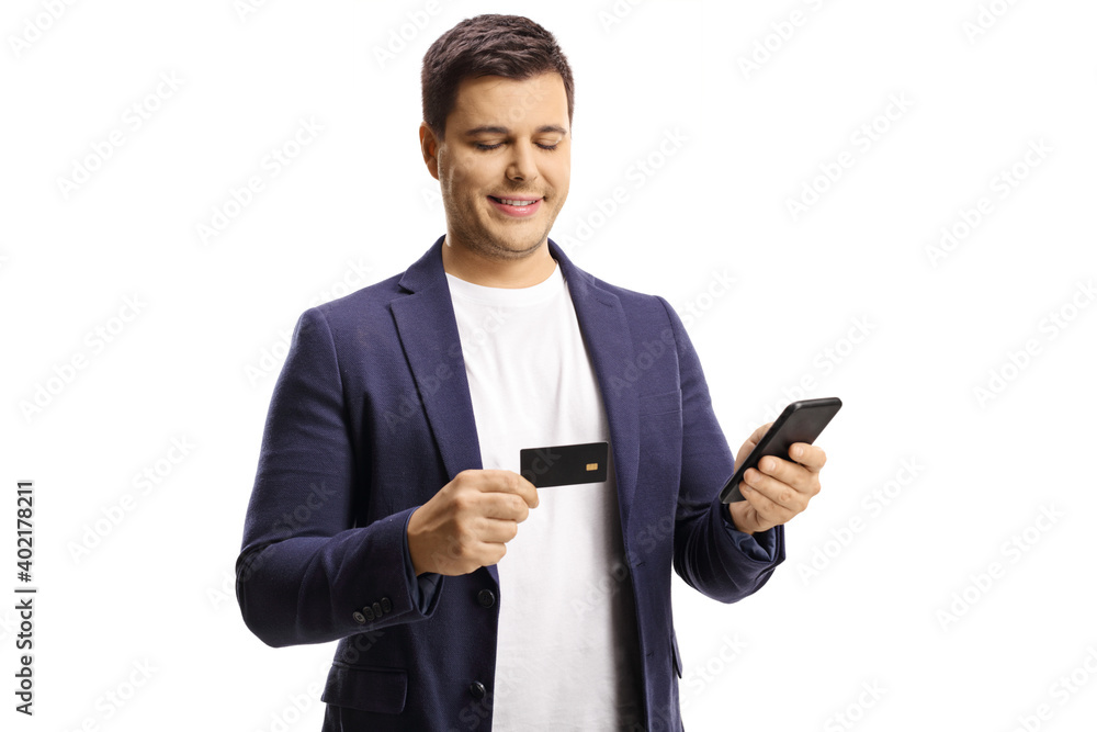 Man using a credit card for online payment via mobile phone