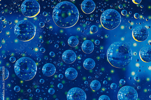 abstract selective focus colorful background with water drops. water bubbles multiple reflections.