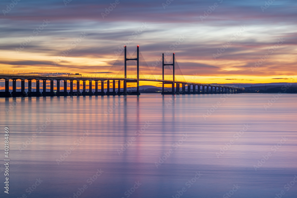 Severn Bridge crossing from England to Wales, at sunset.  The bridge is also called the Price of Wales Bridge