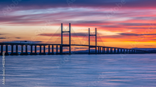 Severn Bridge crossing from England to Wales  at sunset.  The bridge is also called the Price of Wales Bridge