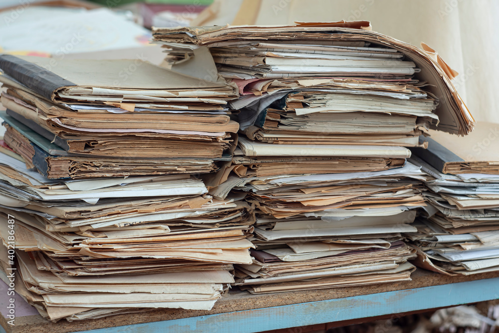 Old, randomly folded paper, as waste paper. Old, randomly folded paper, as waste paper.