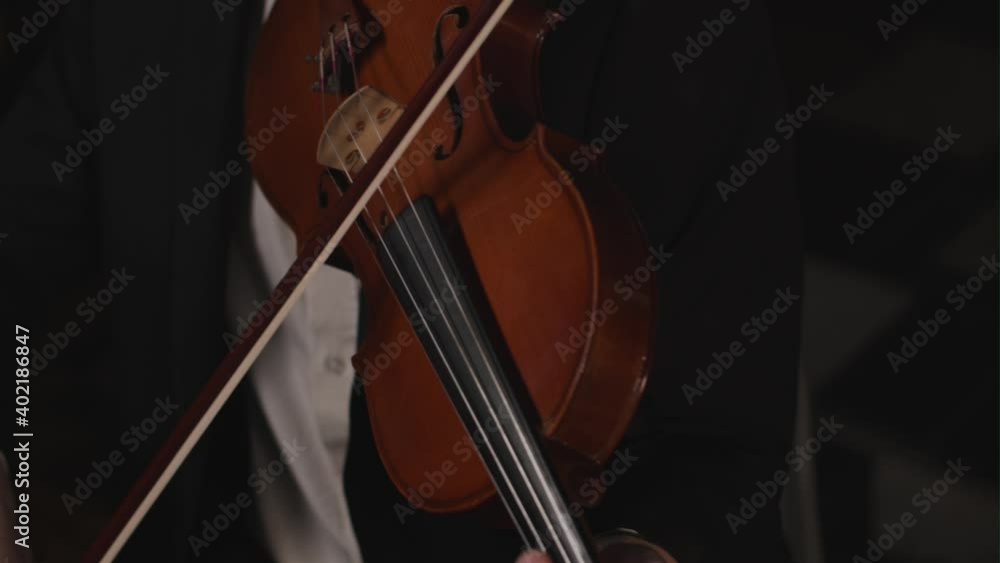 Looking Down At Violin Being Played By Male Violinist Looking Down At Violin Being Played By Male Violinist
