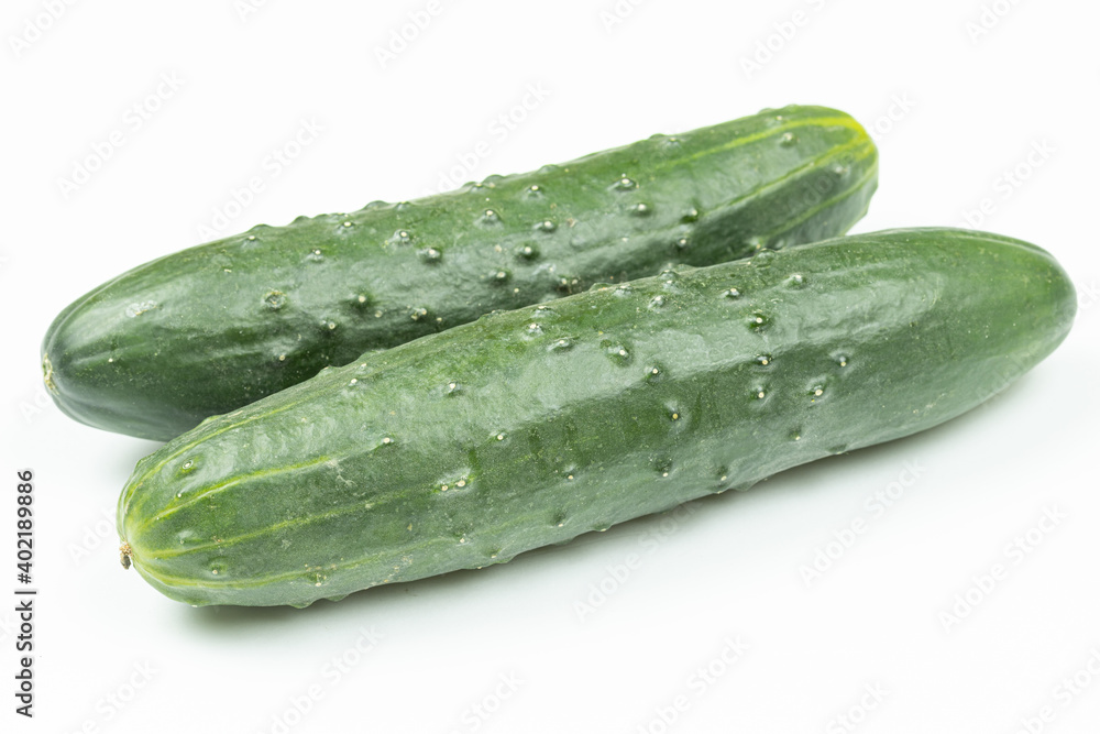 Whole fresh cucumbers isolated above white background Whole fresh cucumbers isolated above white background