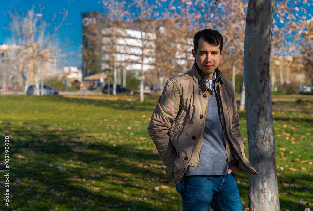 Man posing before the camera in a park Man posing before the camera in a park