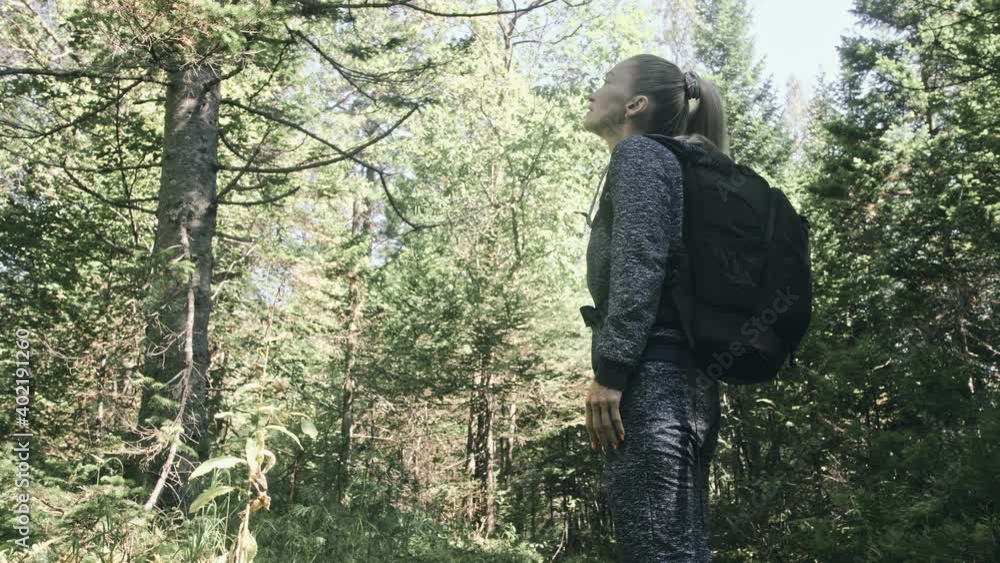 Traveler photographing scenic view in forest. One caucasian woman shooting nice magic look. Girl take photo video on dslr mirrorless camera. Professional photographer travel with backpack. Outdoor. Traveler photographing scenic view in forest. One caucasian woman shooting nice magic look. Girl take photo video on dslr mirrorless camera. Professional photographer travel with backpack. Outdoor.