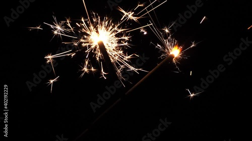 Wallpaper Mural Hand Holding Burning Bengal Fire Stick Fire Sparkling New Year Celebrating Night Dark Sky On Black Background Magical Party Glowing Cinematic Slow Motion   Torontodigital.ca