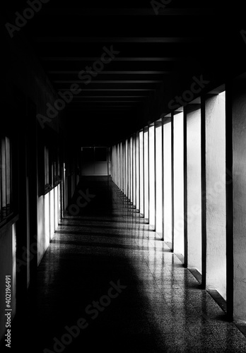 Corridor with columns in grunge tonality photo, abstract architectural photo, desaturated photo, columns, diagonal, street photography. Architectural details